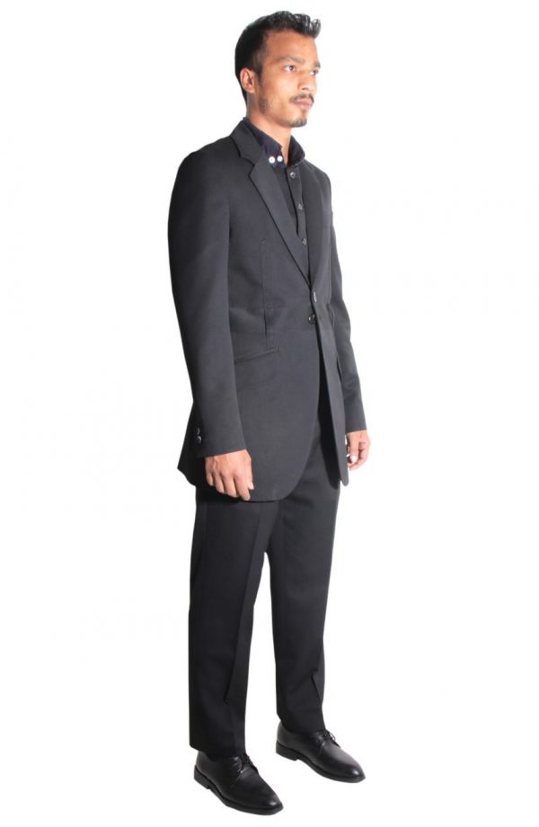 Never The Sinner suit tailored in a belted model with an off-centered vent. Full side view.