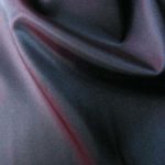 Aubergine color acetate fabric for garment lining.