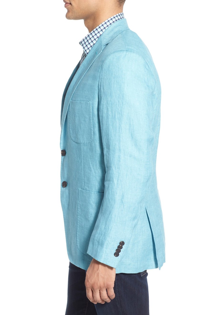 Mens turquoise linen jacket unlined and unstructured, full side view.