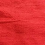 Dupioni silk fabric in red color ideal for suits, jackets, blazers, pants, dresses, skirts, and vests.