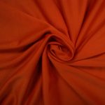 Orange brick satin silk for shirts, dresses, linings, and more.
