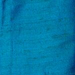 Petrol blue raw silk ideal for suits, shirts, shorts, and dresses.