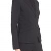 Womens pants suit in tropical wool side view.