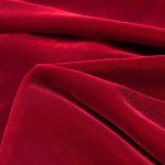 100% cotton velvet in red suitable for suits, coats, dresses, and pants.