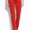 Red velvet mid rise womens skinny pants with pockets.