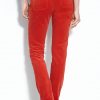 Red velvet mid-rise womens skinny pants with pockets full back view.