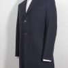 12th Doctor Who navy blue Crombie coat with red lining, a full side view.