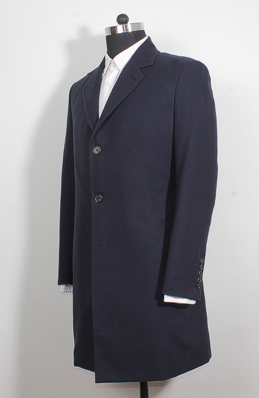12th Doctor Who navy blue Crombie coat with red lining, a full side view.