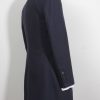 12th Doctor Who navy blue Crombie coat with red lining, a full sleeve view.
