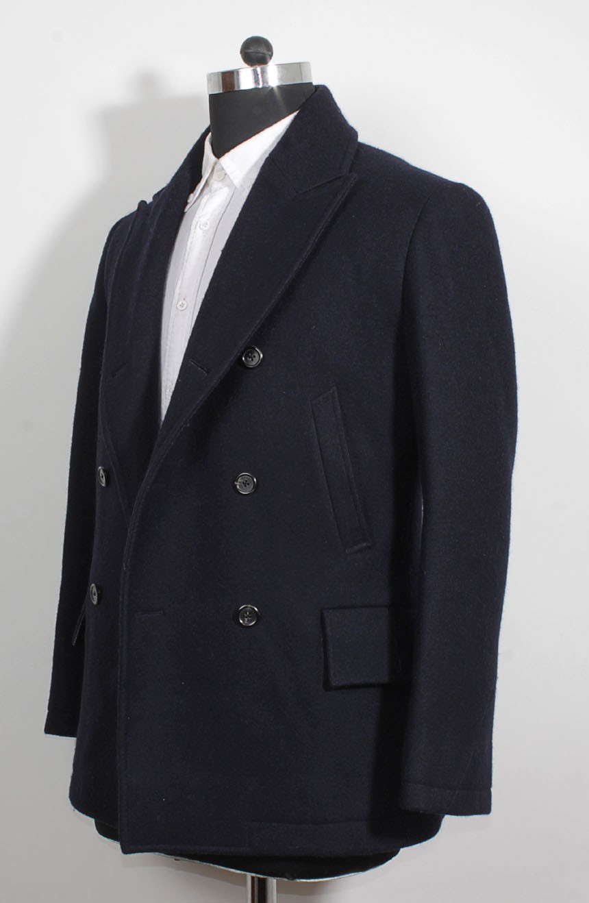 James Bond Skyfall peacoat full side view. The side view of the Skyfall peacoat shows the diagonal waist pocket and the horizontal hip pocket with a flap.
