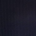 Super 130s' 100% worsted serge wool in Navy suitable for suits, jackets, pants, skirts, vests, and coats.
