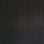 Super 130s' 100% worsted serge wool in Charcoal suitable for suits, jackets, pants, skirts, vests, and coats.