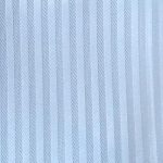 Baby blue color smooth rayon viscose fabric with self stripes ideal for vests, dresses, shirts, and garment lining.