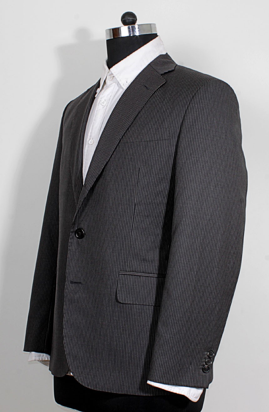 Charcoal grey pinstripe suit to cosplay James Bond from Skyfall, a full side view.