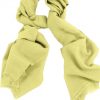 Mens 100% cashmere scarf in baby yellow, single-ply with 1-inch eyelash fringe.