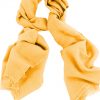 Mens 100% cashmere scarf in honey, single-ply with 1-inch eyelash fringe.