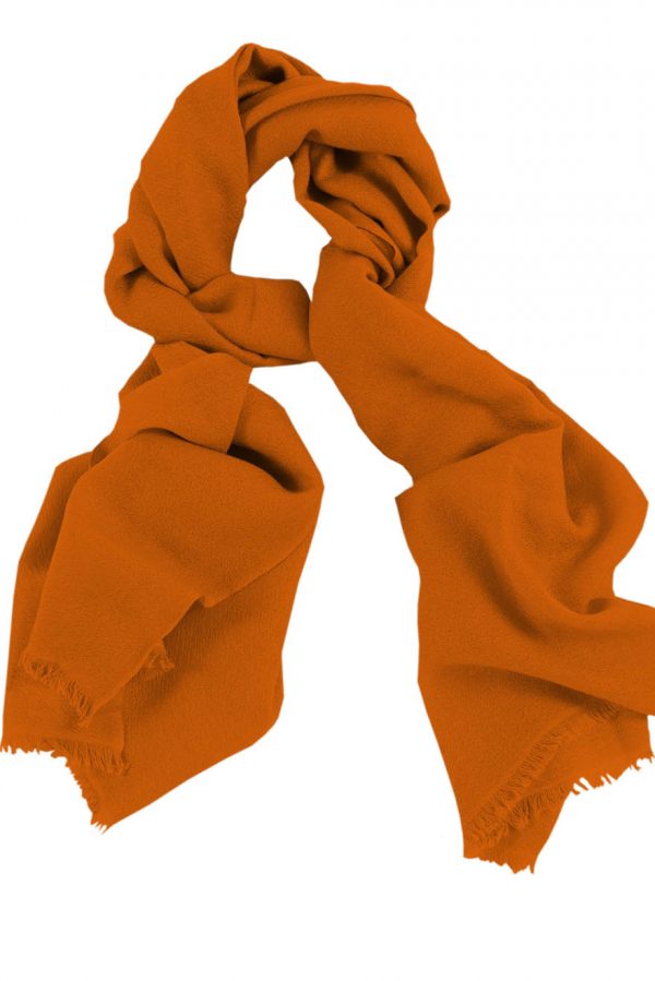 Mens 100% cashmere scarf in pumpkin, single-ply with 1-inch eyelash fringe.