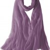 Featherlight cashmere scarf in mauve color, pocketable, lightweight, & ultra-soft to keep you warm weigh just ounces, essential for all women.