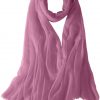 Featherlight cashmere scarf in baby pink color, pocketable, lightweight, & ultra-soft to keep you warm weigh just ounces, essential for all women.