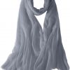 Featherlight cashmere scarf in light silver color, pocketable, lightweight, & ultra-soft to keep you warm weigh just ounces, essential for all women.