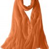 Featherlight cashmere scarf in ginger color, pocketable, lightweight, & ultra-soft to keep you warm weigh just ounces, essential for all women.