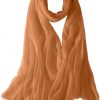 Featherlight cashmere scarf in tan-hide color, pocketable, lightweight, & ultra-soft to keep you warm weigh just ounces, essential for all women.