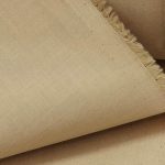 Lightweight cappuccino color cotton fabric for trims and piping in the custom-made garments.