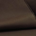 Lightweight chocolate brown cotton fabric for trims and piping in the custom-made garments.