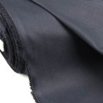 Lightweight dark grey cotton fabric for trims and piping in the custom-made garments.