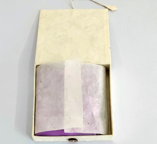 Custom silk pocket squares handmade in pastel pink & silver wrapped in tissue in a hardcover box.